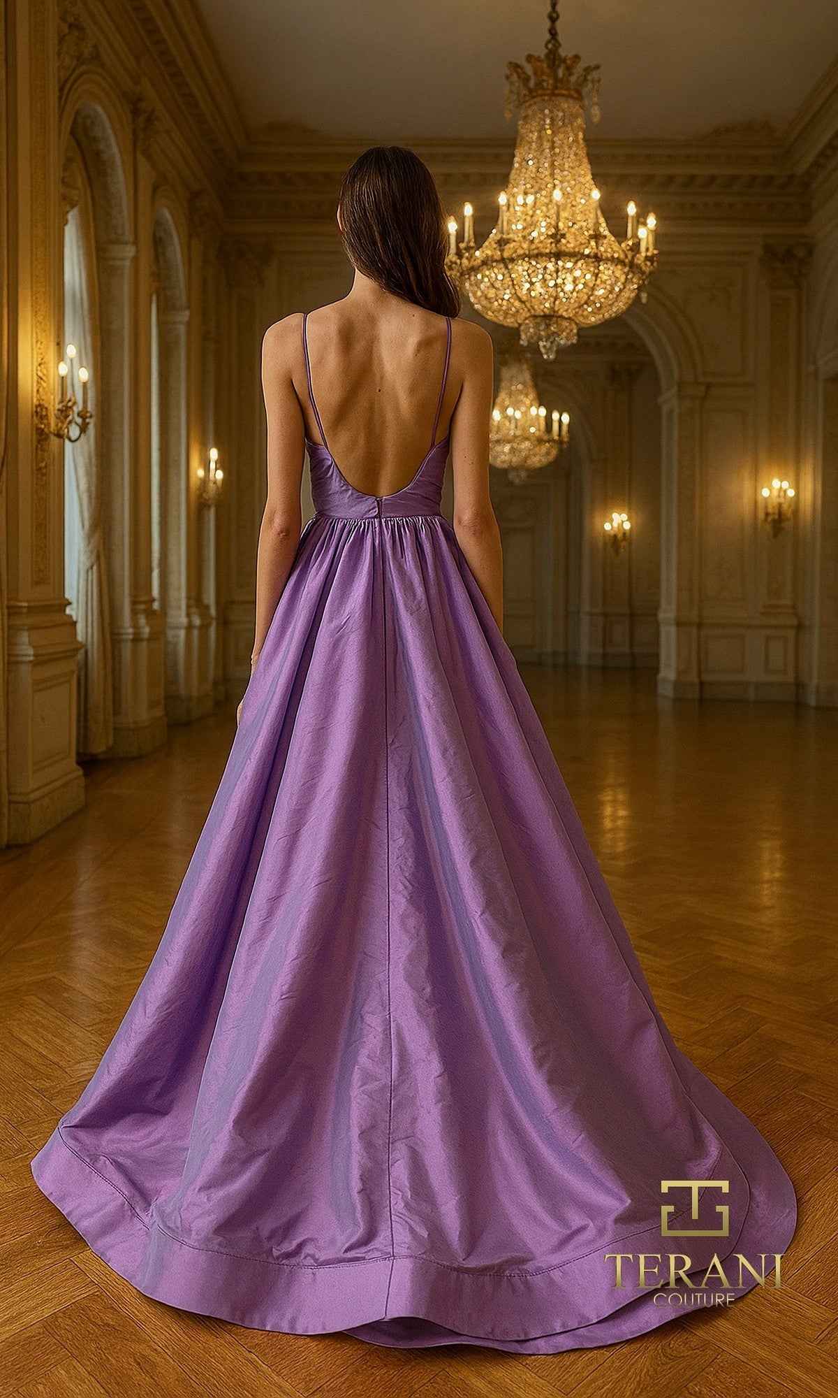 A woman in a sleeveless, floor-length Long Formal Dress: Terani 261P6172 stands in an ornate ballroom with chandeliers, facing away from the camera.